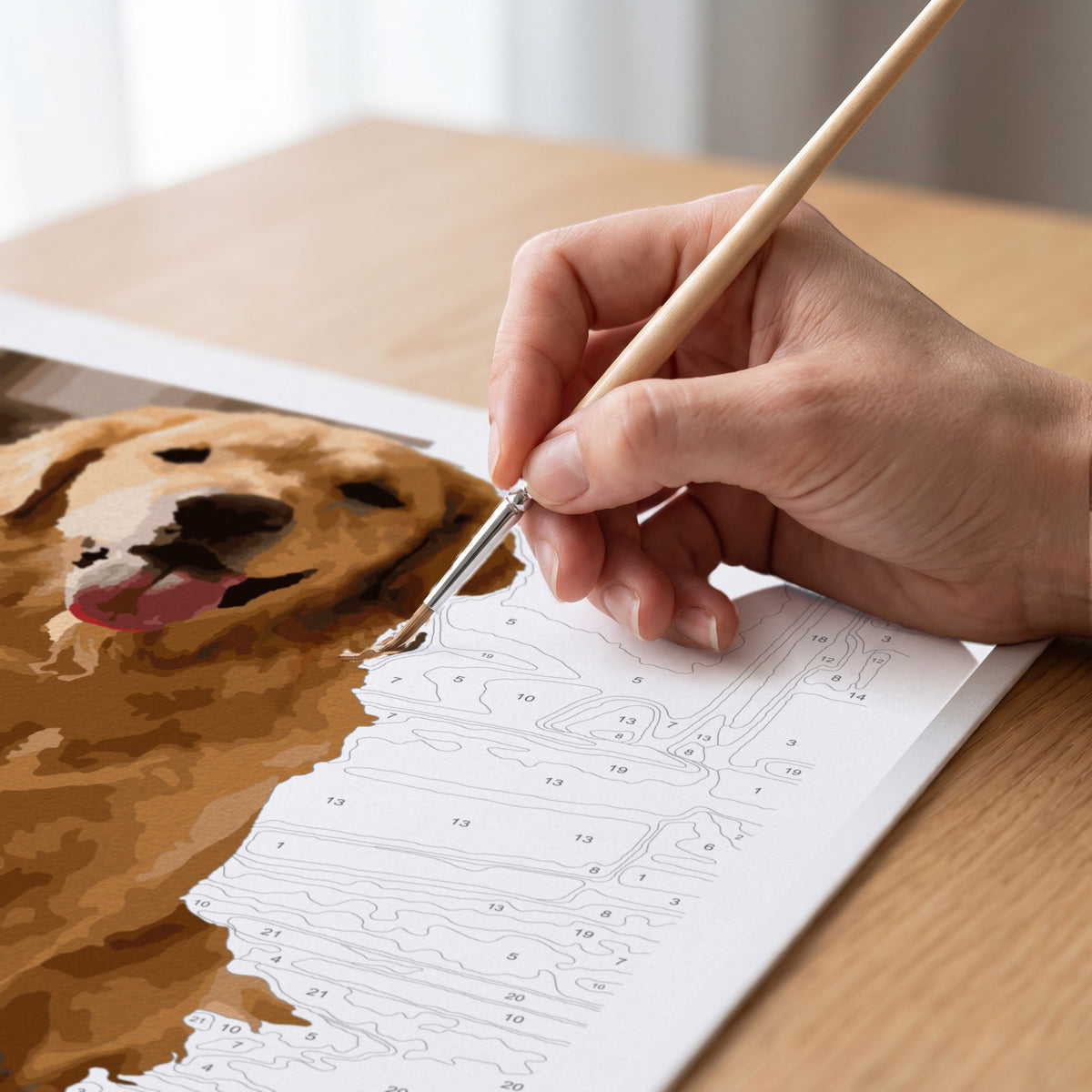 Painting fine detail on a dog portrait with a detail brush
