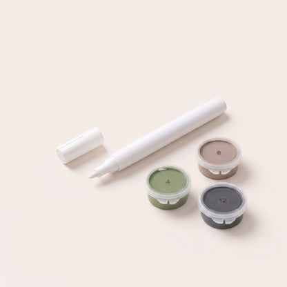 Number cover pen next to numbered paint pots