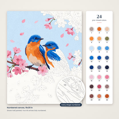 Bluebirds on Cherry Blossoms numbered canvas, half painted, with the 24 numbered paint colors