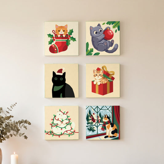 Christmas Cats Mini Set: six finished mini paintings hung on the wall