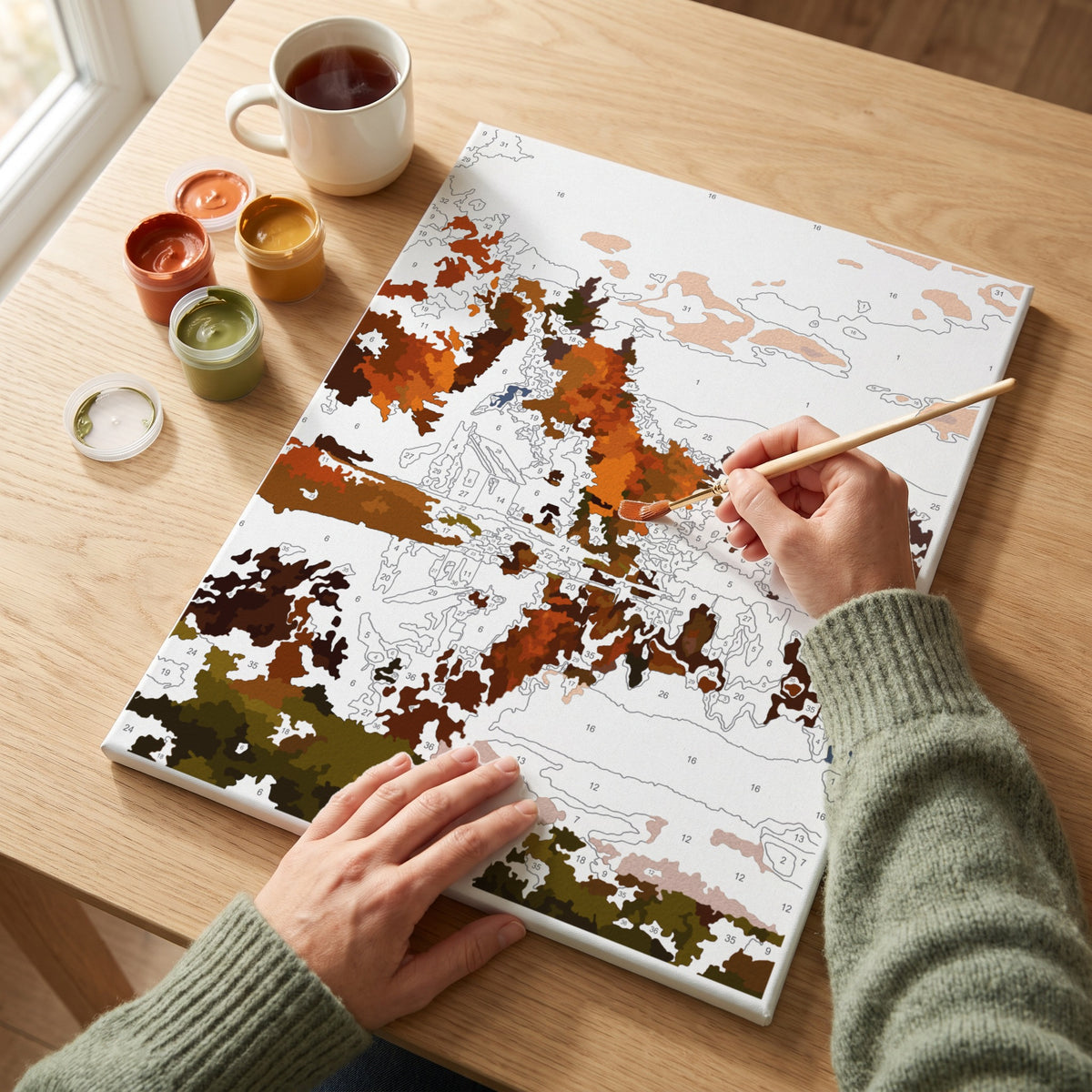 Painting the mystery kit blind: about a third of the numbered canvas filled in with abstract autumn colour patches